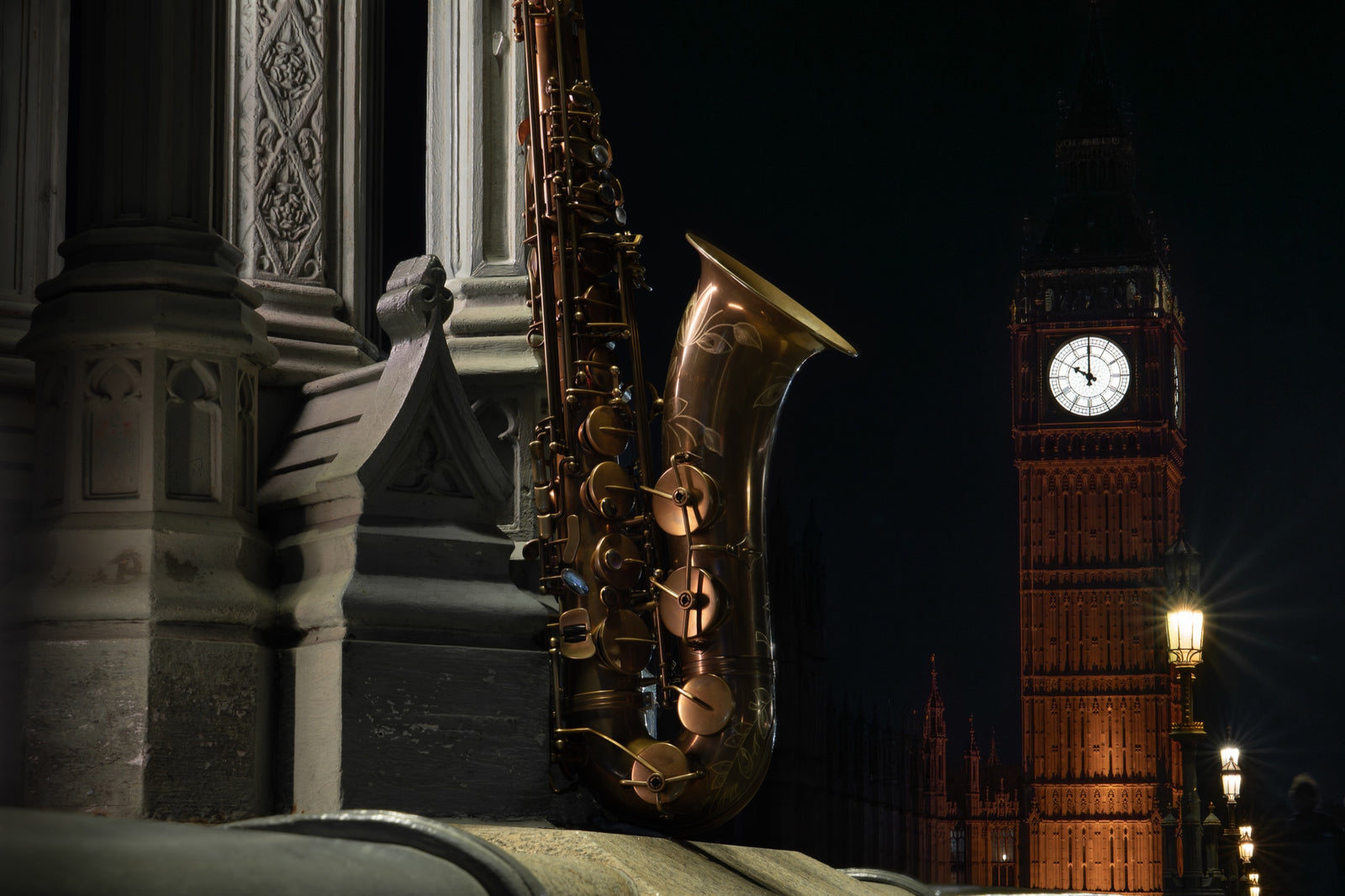 Atlantic London saxophone beside the illuminated Elizabeth Tower in London